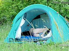 nudist milf albta relaxes in the tent at the beach