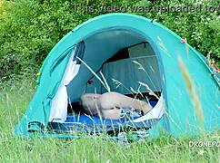nudist milf albta relaxes in the tent at the beach
