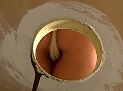 Veronica Avluv sucks cock through glory hole, masturbating