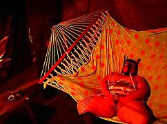 getting frisky in a tent, fingering her wet hole in a hammock...