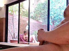 my stepson pulls out his huge cock on the terrace, gets aroused watching me through the window, and displays his erection to the neighbors while my nipples harden without a bra