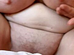 Mature woman plays with pussy close-up, dirty talking in sexy voice