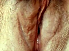 Mature woman plays with pussy close-up, dirty talking in sexy voice