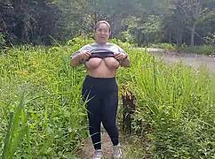 In the great outdoors, a big-boobed Latina girl flashes her tits and ass for all to see