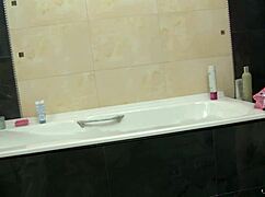 Tiny blonde Paula Z fingers eager pussy in bathtub