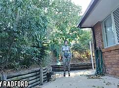 She walks outdoors and tries on a bikini