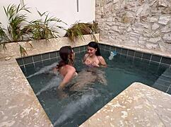 two hot lesbians masturbating in a public pool, scared of getting caught.