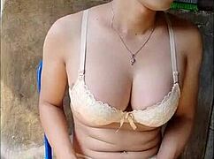 An amateur shemale masturbates nervously in the open bathroom.