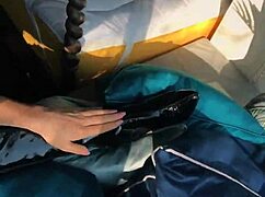 Woman shows off in wetlook suit and patent leather boots