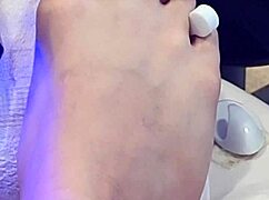 Shemale receives foot treatment.