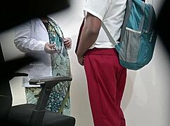 lady doctor tenderly checking school student's dick