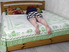 Stepmom lies on bed inviting stepson for anal sex!