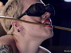 Blonde Slave In Gas Mask Endures Intense Bondage And Whipping