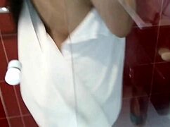 latina milf bathes under shower, showing natural huge tits