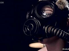 Blonde Slave In Gas Mask Endures Intense Bondage And Whipping
