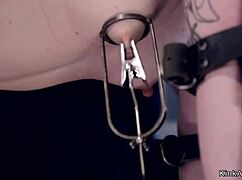 Blonde Slave In Gas Mask Endures Intense Bondage And Whipping