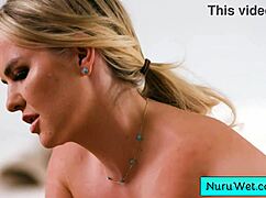 sexy blonde masseuse rubs her natural big boobs in nuru gel on client during slippery massage