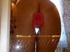 Girl with appetizing ass having fun in shower with pink dick