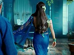 Rani Mukharji slips out of her saree, flashing panty glimpses and curvy ass cheeks in tight view.
