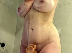 chubby blonde horny in shower? watch her ram big dildo deep!