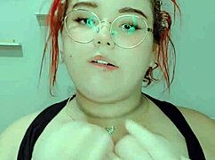 hot redhead fingers her wet pussy in solo bliss