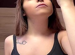 girl struts around braless with her massive huge tits spilling from tight tanktop