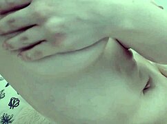 blonde oils up her big boobs and teases pussy in ripped strip