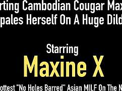 How does that squirting Cambodian cougar Maxine X handle impaling on a massive dildo in fishnets?