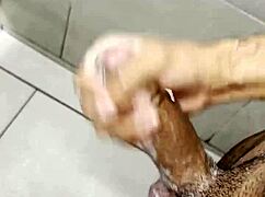 i'm stroking my cock so hard in the gym bathroom