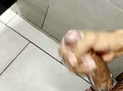 i'm stroking my cock so hard in the gym bathroom