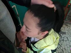 Brunette teen girlfriend sucks huge cock on public staircase swallowing cum mouthful