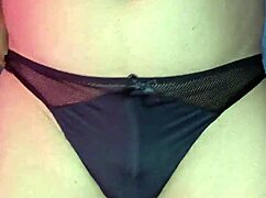 a mexican girl in lingerie dances while modeling her satin panties and bra