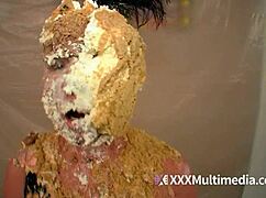 two blondes soak up wet messy fun pieing each other's faces