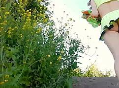 SPUNKY BLONDE TEEN MODEL STRIPS NAKED OUTDOORS IN MINISKIRT