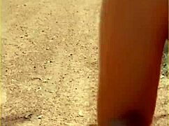 wifey lifts shirt flashing her bare milf tits outdoors