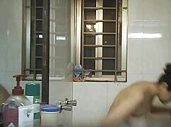 Hidden camera spies on busty Indian BBW shower bathing solo