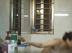 Hidden camera spies on busty Indian BBW shower bathing solo