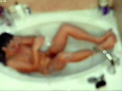 solo guy enjoys relaxing bubble bath in pool