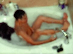 solo guy enjoys relaxing bubble bath in pool