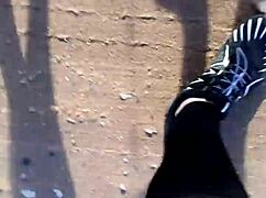 She tries on her new barefoot shoes outdoors