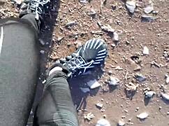 She tries on her new barefoot shoes outdoors