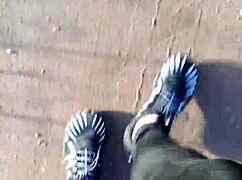 She tries on her new barefoot shoes outdoors