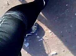 She tries on her new barefoot shoes outdoors