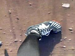 She tries on her new barefoot shoes outdoors