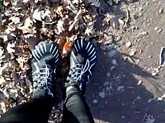She tries on her new barefoot shoes outdoors
