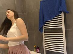 horny braless brunette flashes ass legs in bathroom skirt