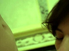 the short-haired girlfriend drops to knees moaning while slurping boyfriend's cock homemade style