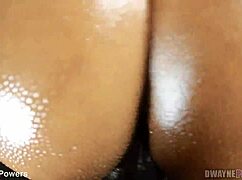 POV captures oiled ebony ass bent over for close monster BBC doggystyle thrusting