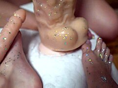 two cuties stroke huge rubber cock with their shiny legs