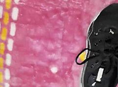 cumshot lands right on the tennis shoes in fetish play.